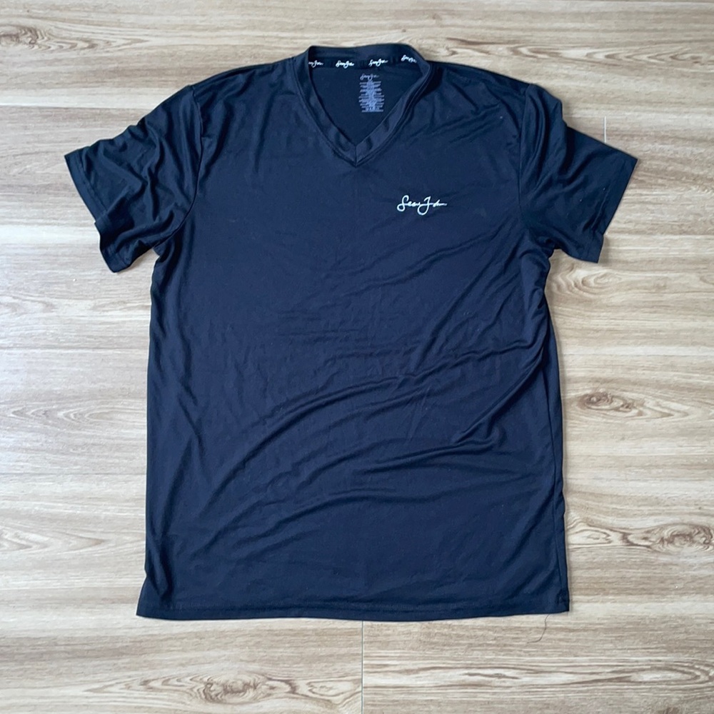Black Sean John V-neck Tee 95% Polyester.                      Fits like a large